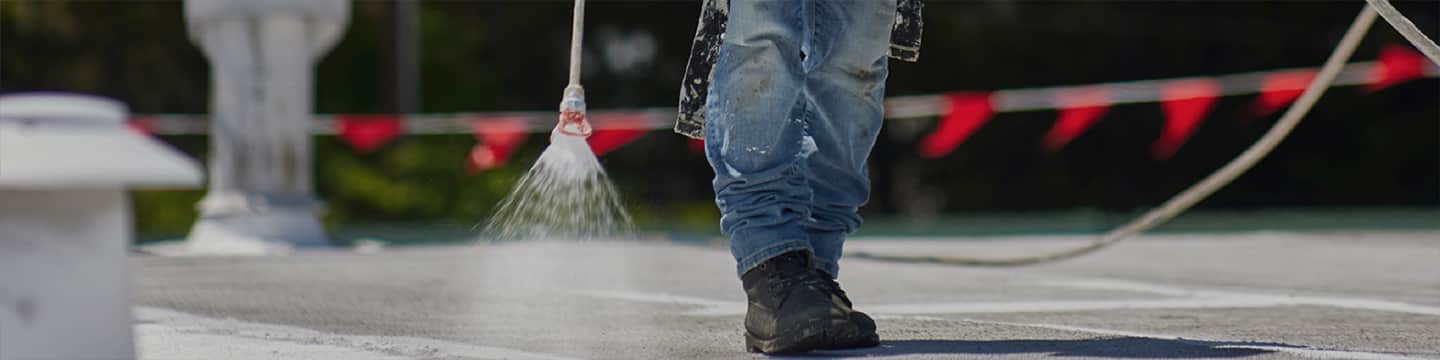 Manufacturer reference: spray application of a roof coating on a low-slope roof
